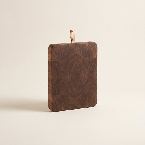 End-grain walnut cutting board with leather loop