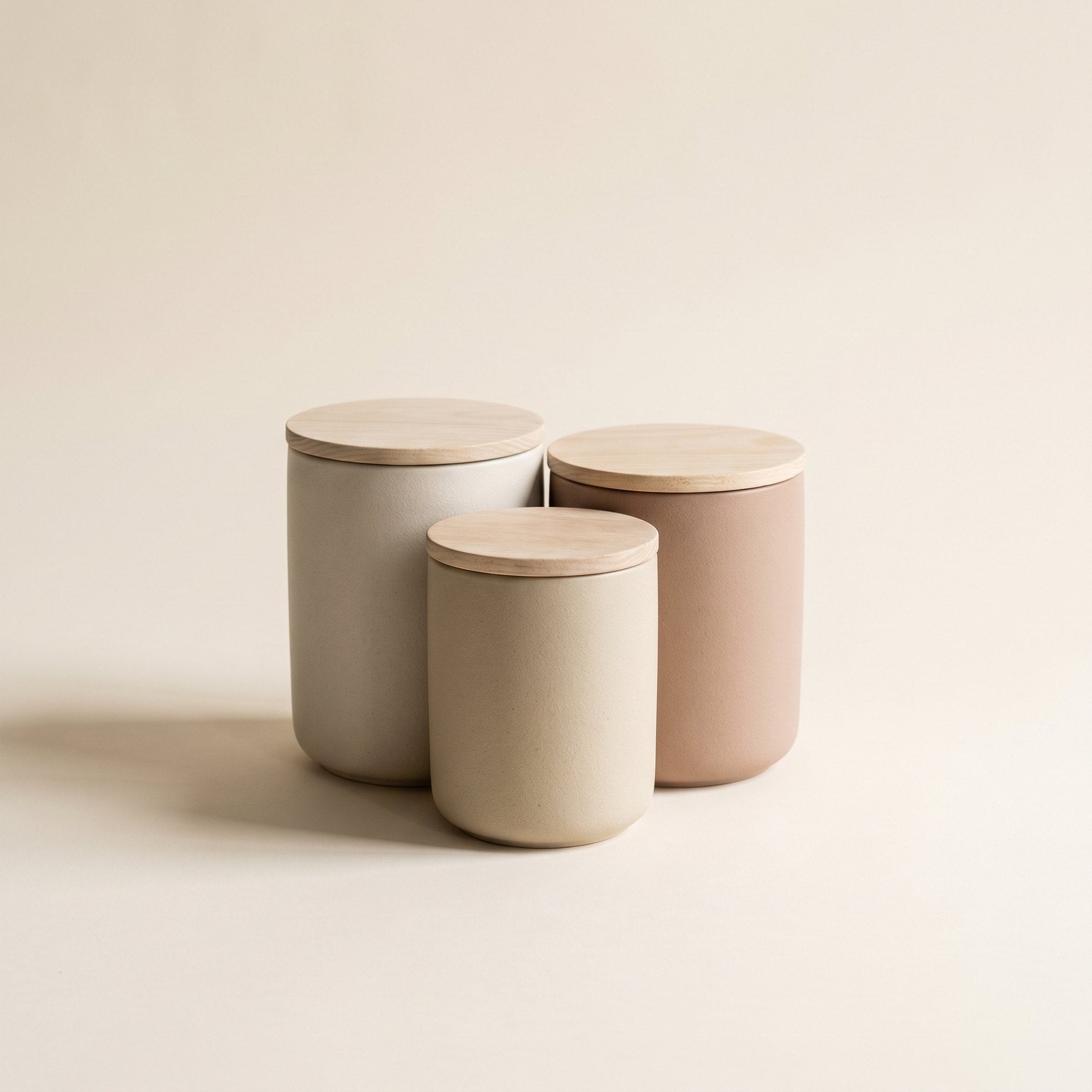 Set of three ceramic canisters with ash wood lids