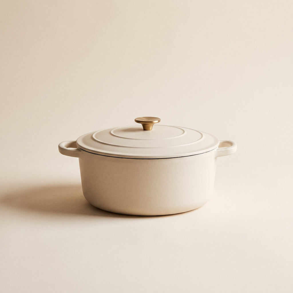 Cream enamelled cast-iron dutch oven with brass knob